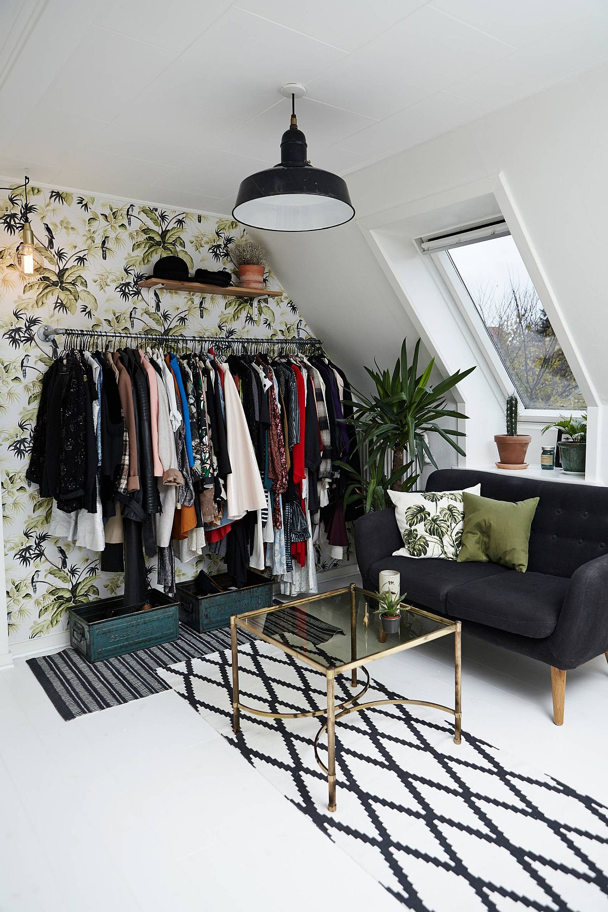 Attic bedroom open closet with wall behind it that adds pattern and color to the setting