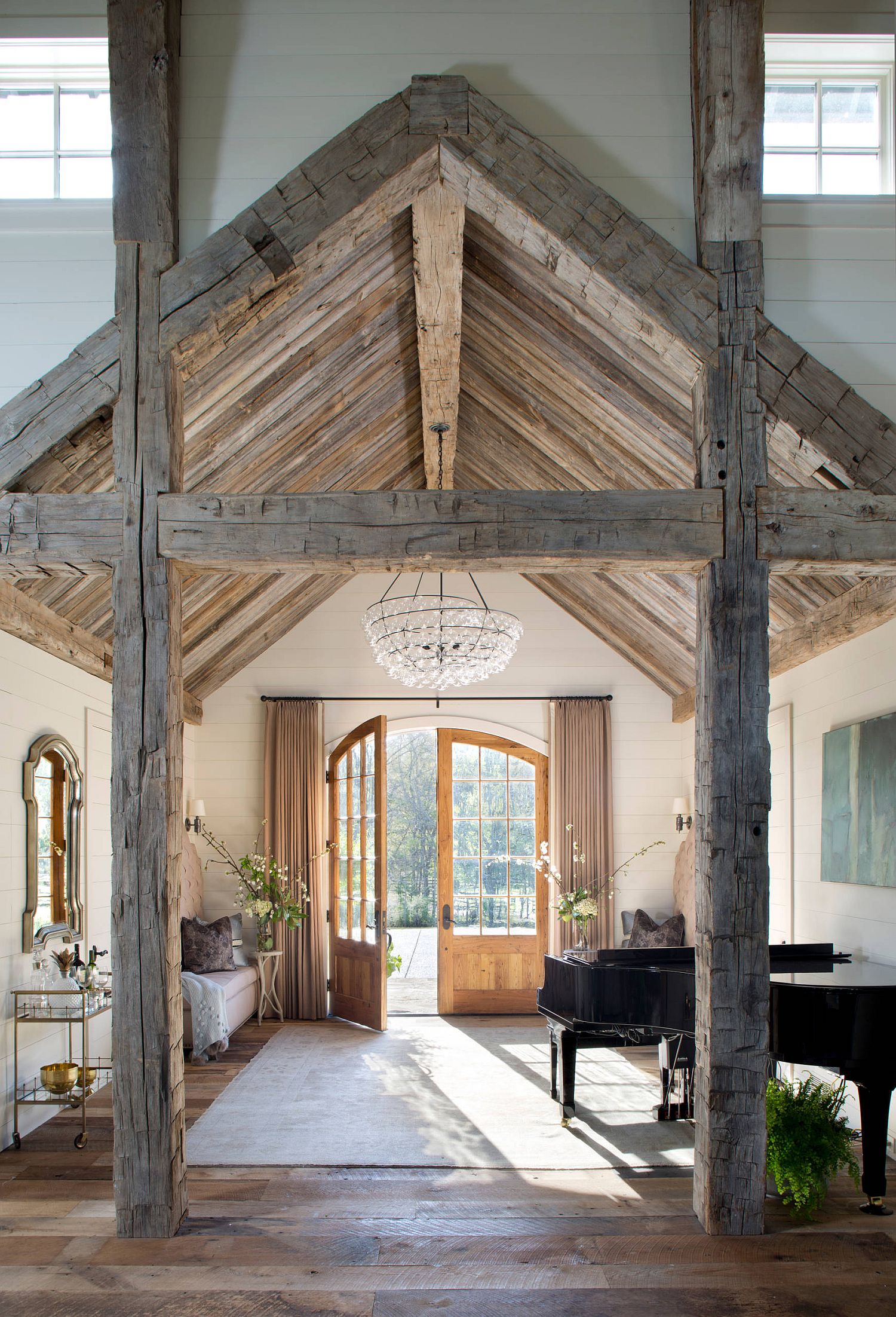 Awesome farmhouse style entry with brilliant use of wooden beams and ceiling tha create a room within a room