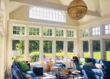 Beautiful-influx-of-blue-in-the-spacious-and-traditional-sunroom-of-Boston-home-using-couch-and-club-chairs-83767-217x155