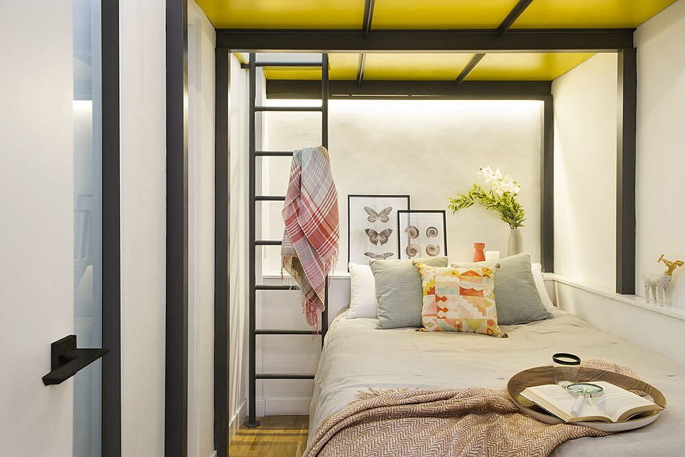 Beautiful little guest bedroom with yellow ceiling, metallic beams and walls in white