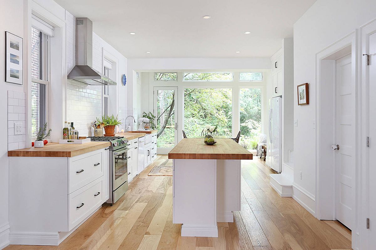 Beautiful white and wood kichen with countertops that add to the overall color palette