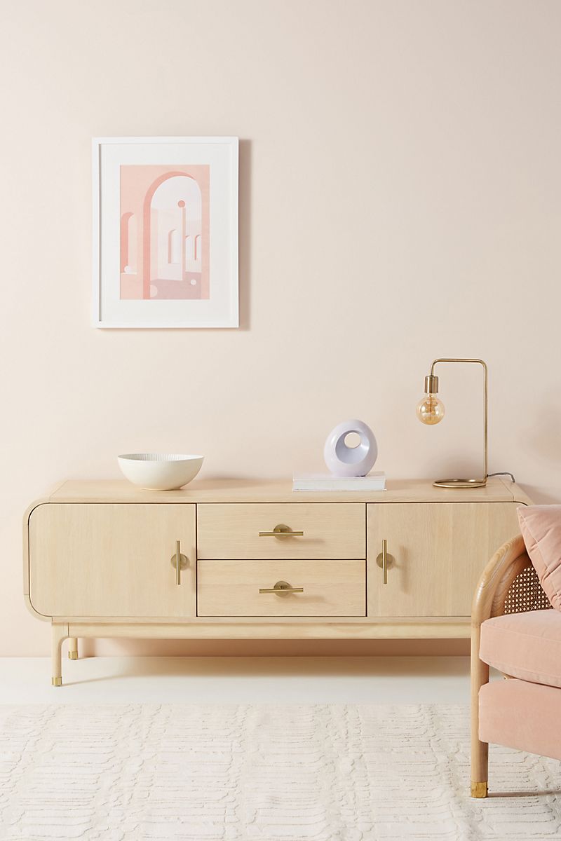 Bleached oak media console with asymmetrical styling