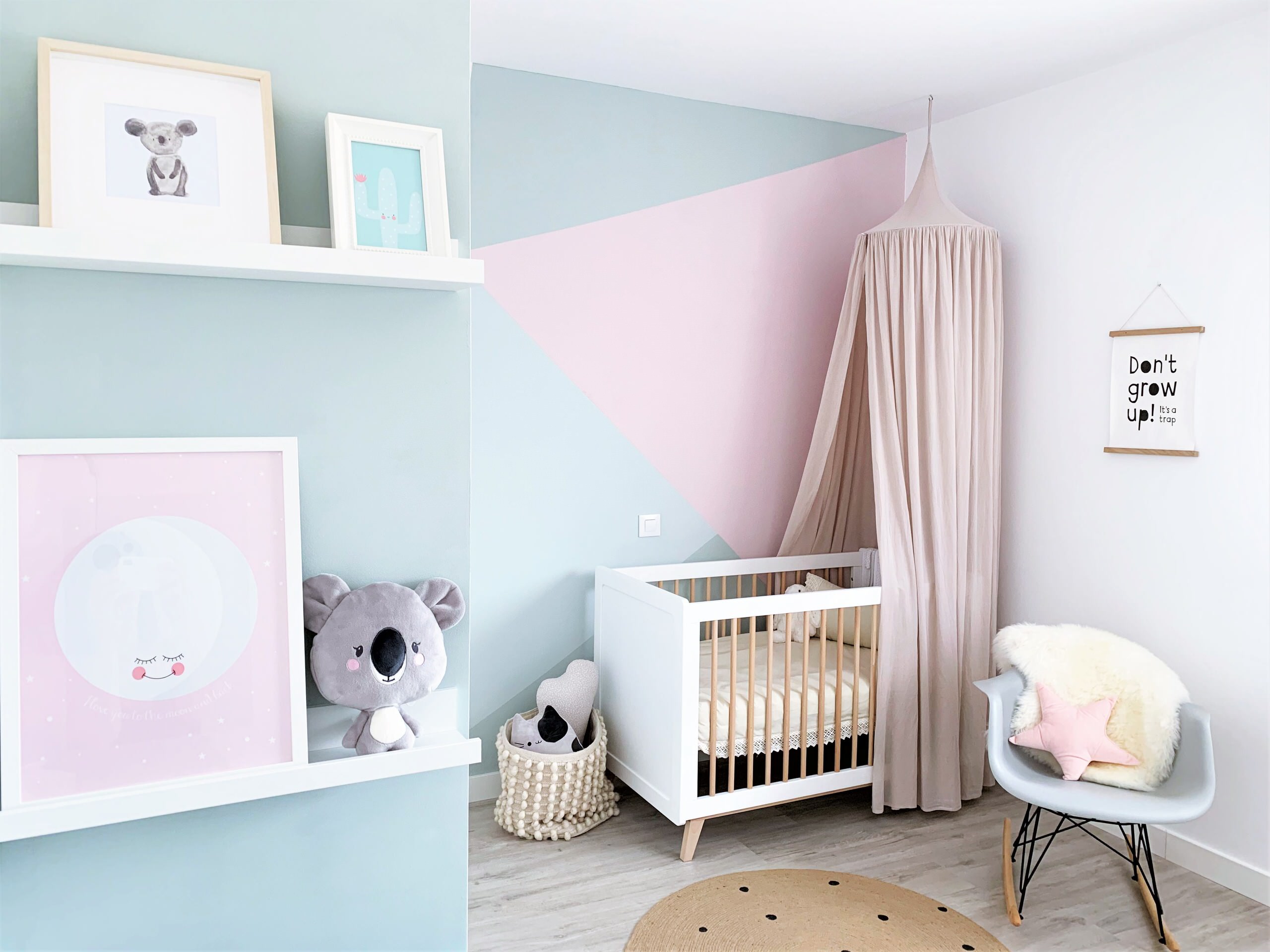 Blocks of pastel pink and blue make a big difference to the backdrop of this modern nursery