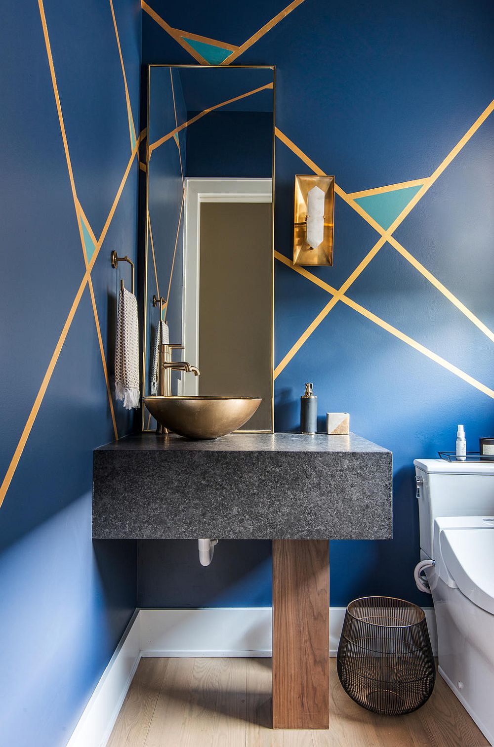 Brilliant use of Classic Blue in the small contemporary powder room with stone vanity