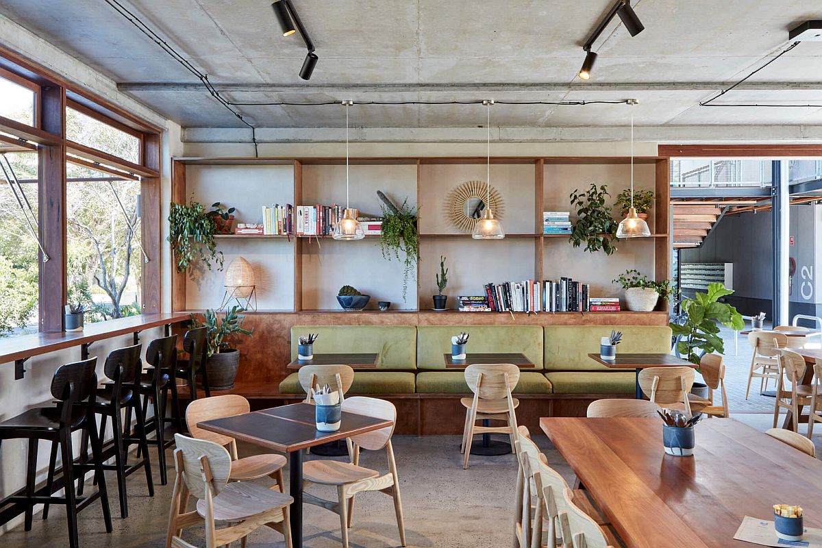 CUstom decor adds elegance to the interior of the restaurant with concrete backdrop