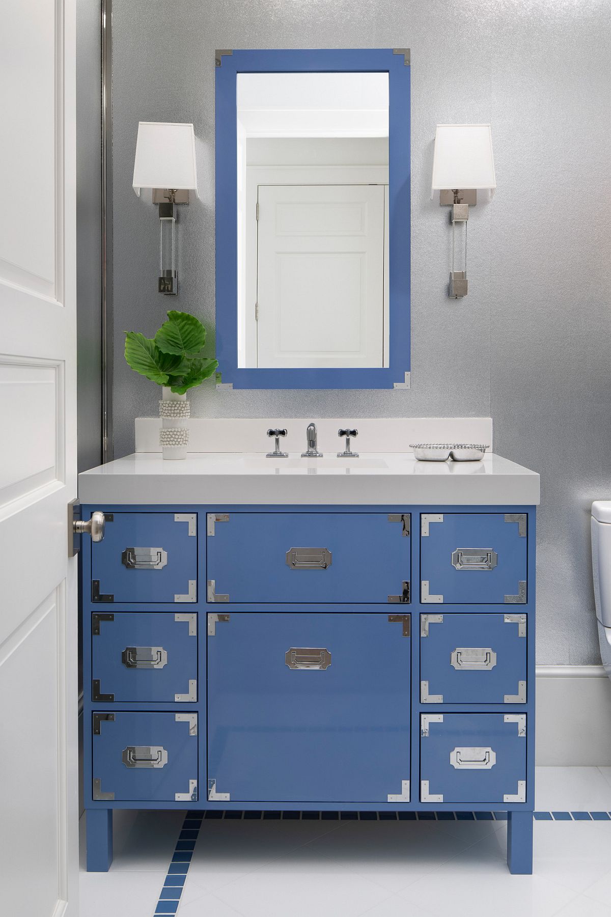 Chic-powder-room-in-gray-with-exquisite-vanity-in-blue-and-a-mirror-that-has-a-frame-in-matching-shade-29652