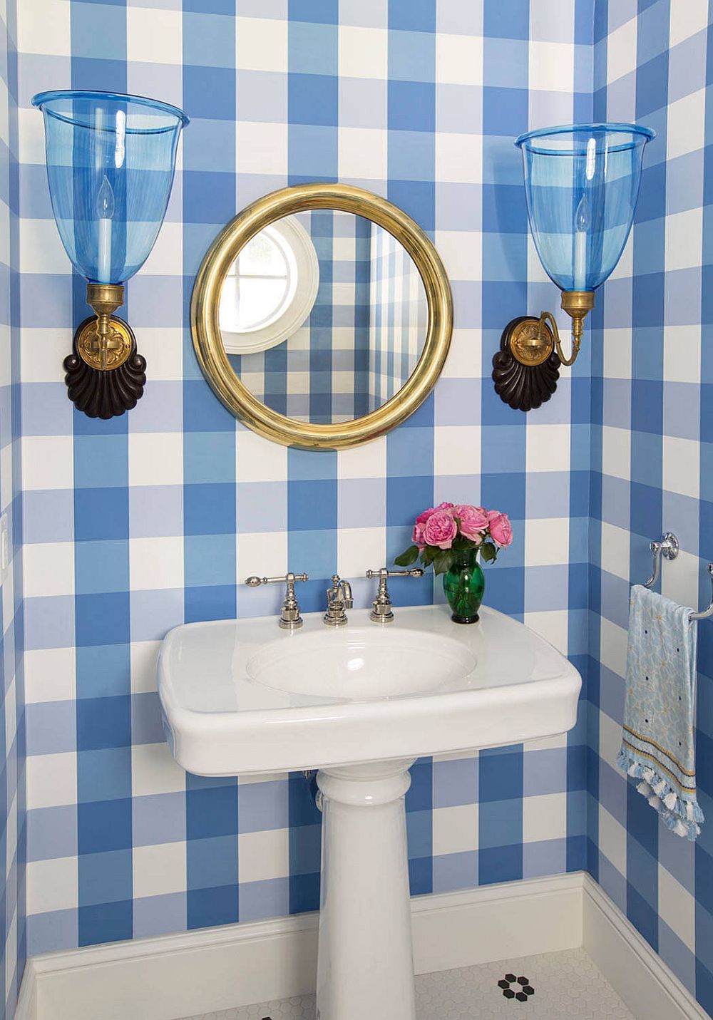 Classic beach style powder room with checkered pattern on walls that steals the show