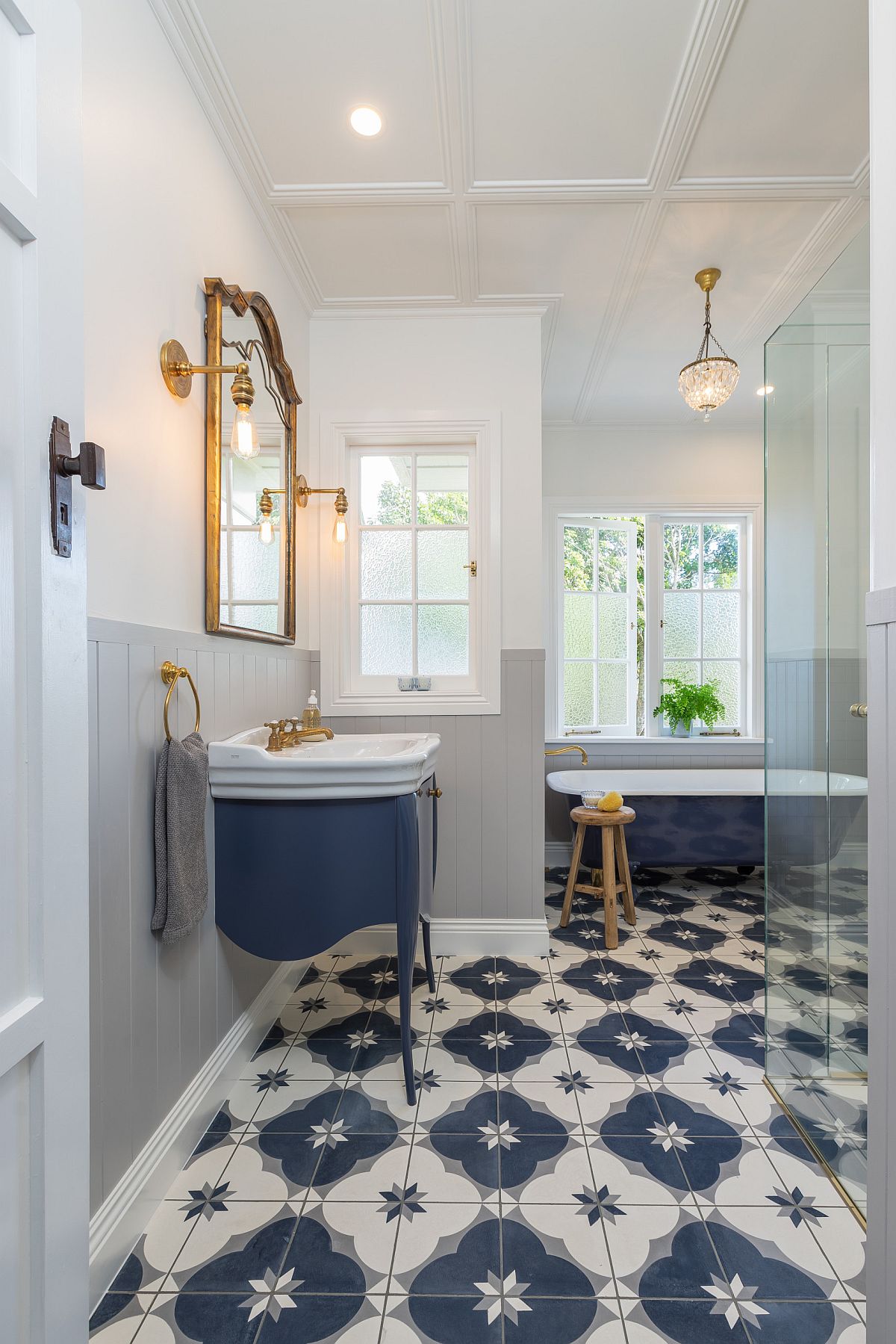 Classic-blue-used-to-highlight-both-the-vanity-and-bathtub-in-the-bathroom-78095