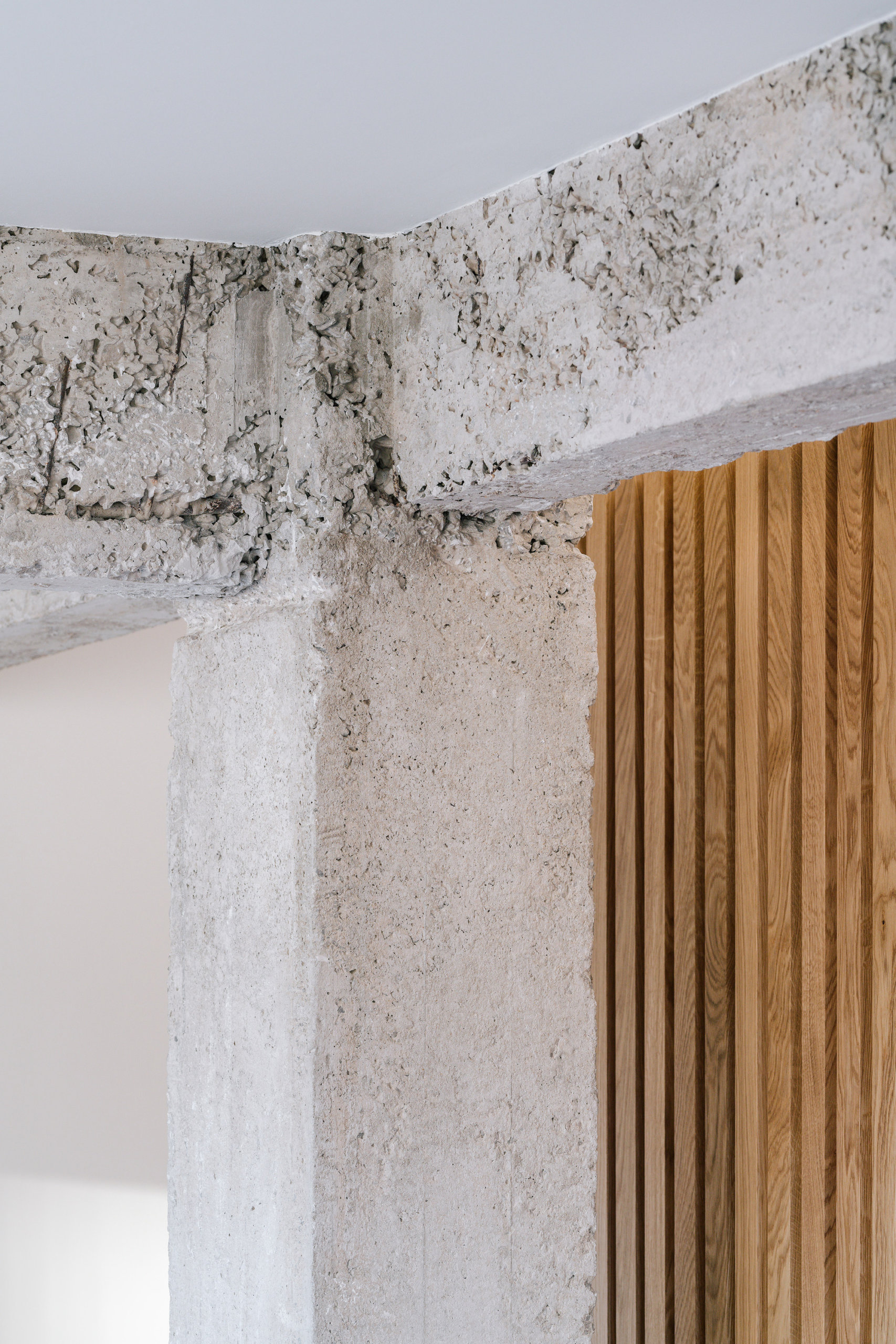 Combining the rugged concrete finishes inside the apartment with warmth of wood