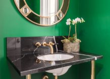 Dark-green-powder-room-with-gold-and-black-sink-and-matching-mirror-frame-38938-217x155