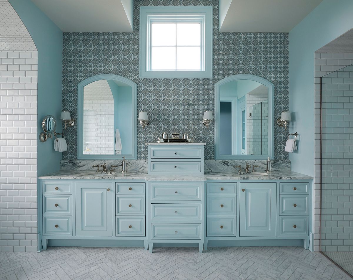 Delightful master bathroom seems to exude a blue glow all around!