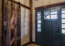 Door-in-blue-adds-color-to-the-entry-space-in-white-with-reclaimed-wood-wall-section-36536-217x155