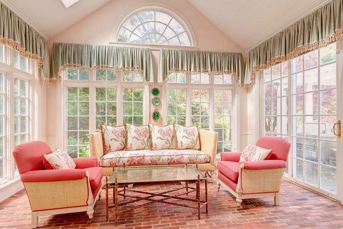 Exquisite traditional sunroom in pink and green feels both inviting and colorful