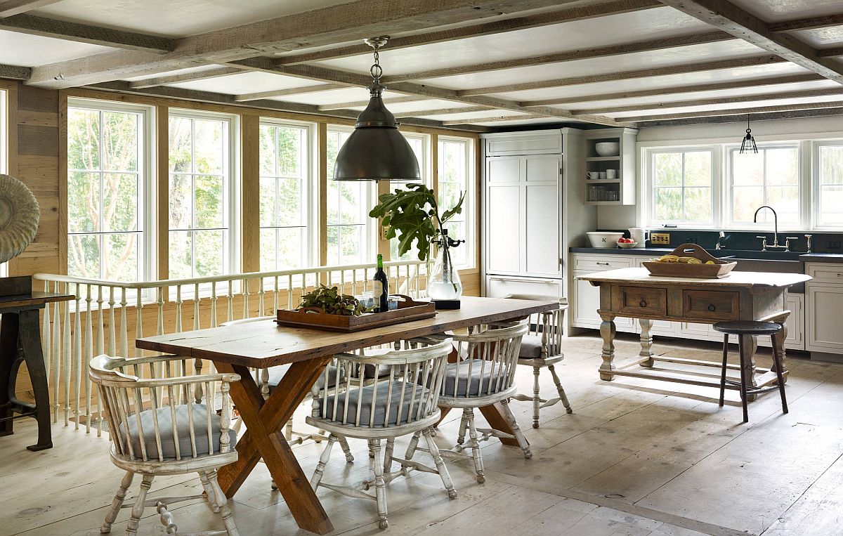 Farmhouse style eat-in kitchen with low ceiling and gorgeous lighting