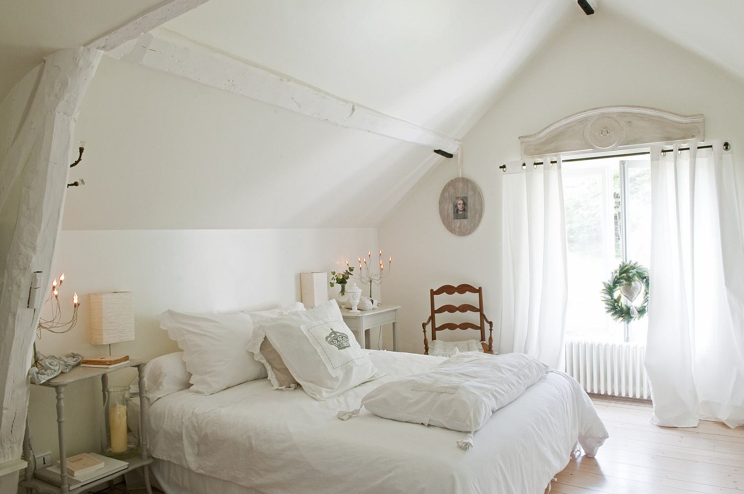 French-counry-style-and-a-sense-of-delicate-sophistication-fill-this-light-filled-white-attic-bedroom-90450