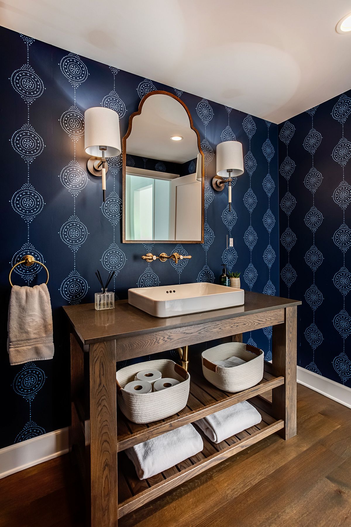 Gorgeous wallpaper in blue brings both color and pattern to this modern farmhouse powder room