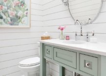 Gorgeous-powder-room-in-white-with-pastel-green-vanity-and-a-skylight-that-brings-in-natural-light-85163-217x155