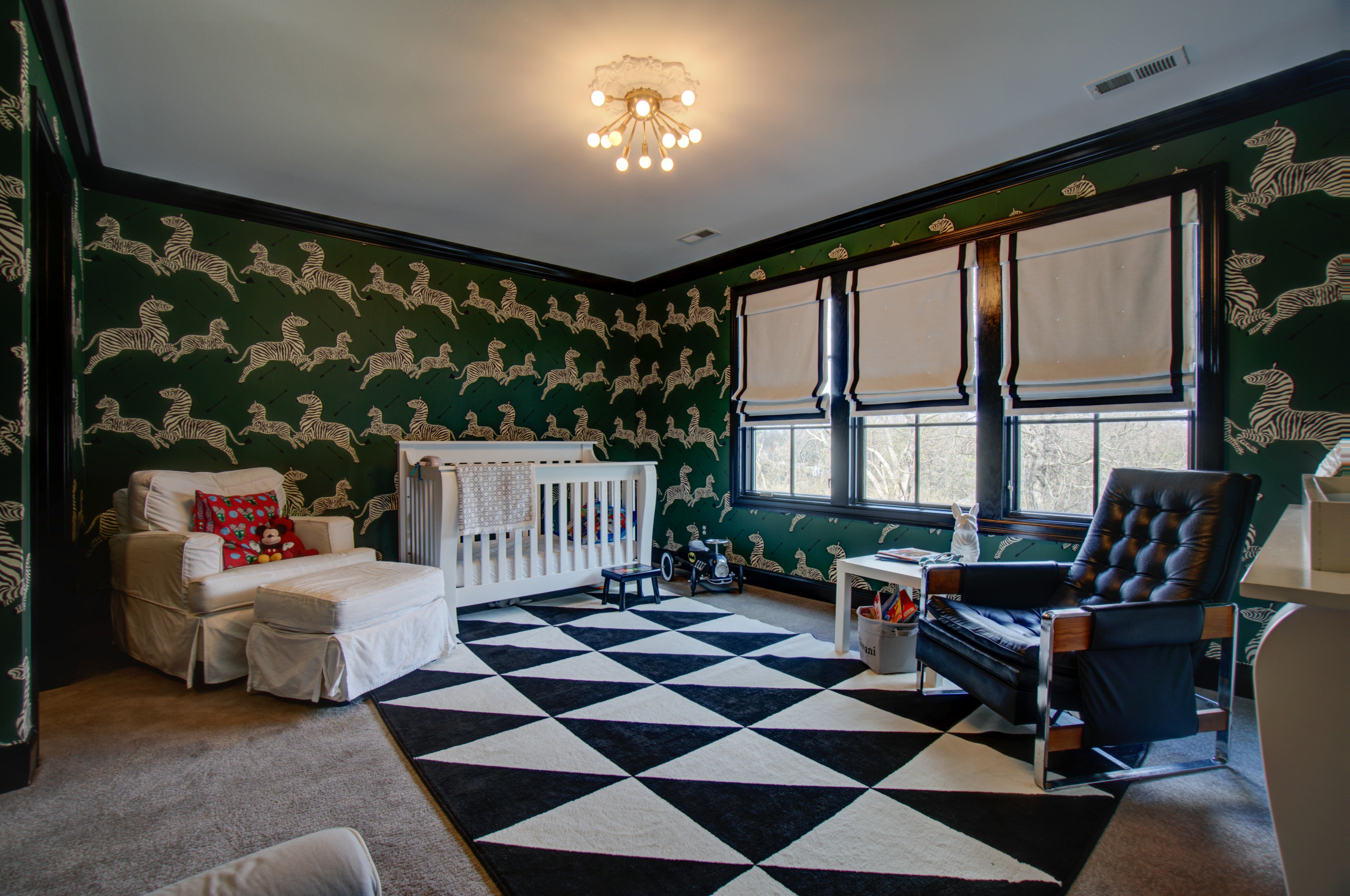 Gorgeous wallpaper in green with pattern that adds cheer to the lovely nursery