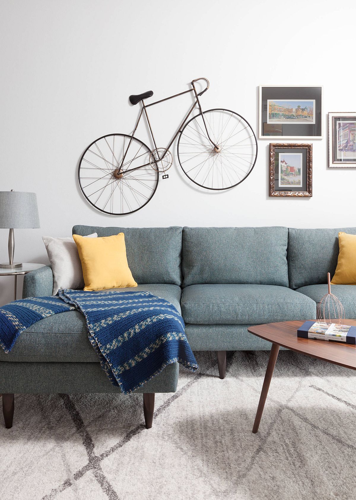 Gray sectional saves space in the tiny white living room