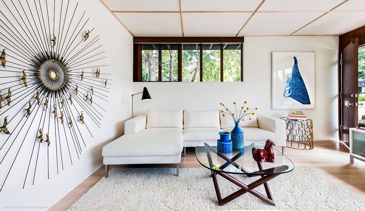 Low ceiling gives the white living room a more dramatic visual appeal