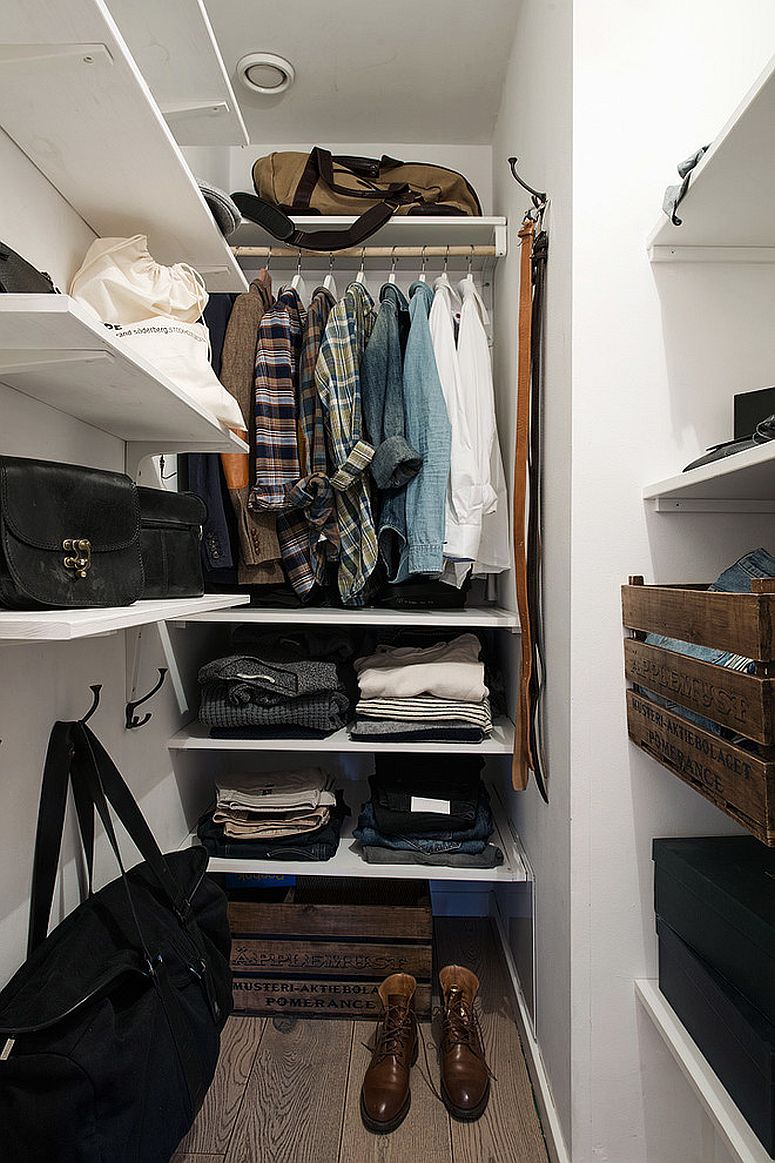 Open shelves for the space-savvy closet inside the modern apartment bedroom