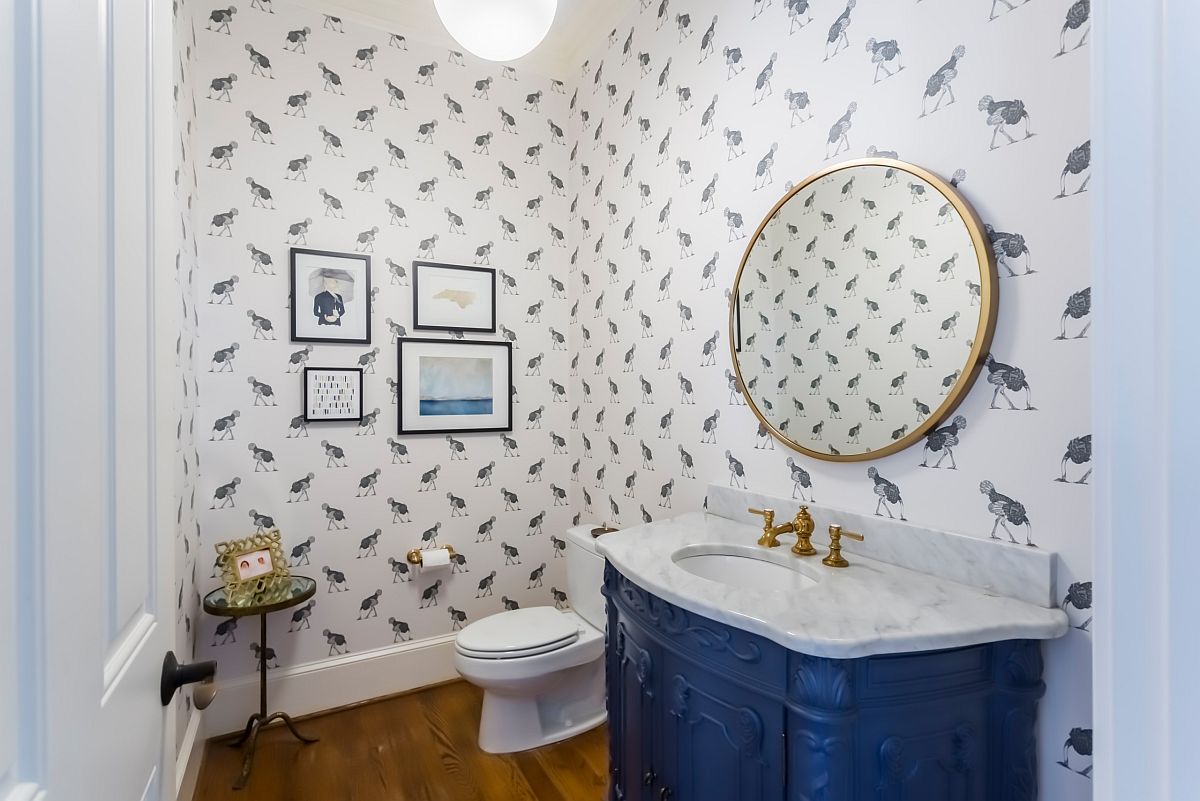 Powder-room-with-wallpaper-that-adds-fun-motifs-and-a-blue-vanity-with-a-dash-of-pattern-95557