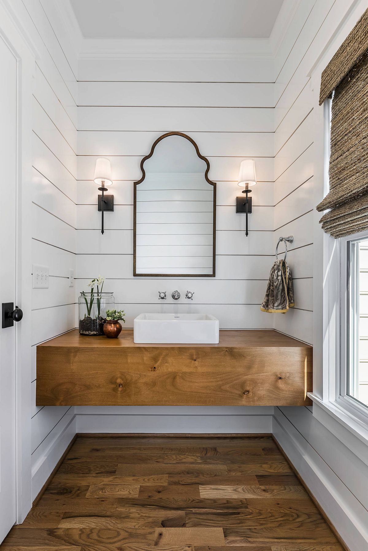 Simple and elegant farmhouse style powder room makes smart use of space