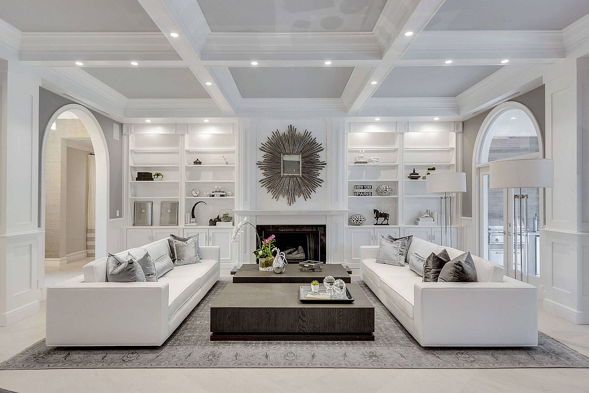 Small living room in white of Paris home with curated dark accents