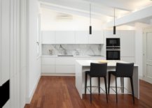 Sophisticated-minimal-kitchen-in-white-where-bar-chairs-and-appliances-usher-in-a-dash-of-black-39191-217x155