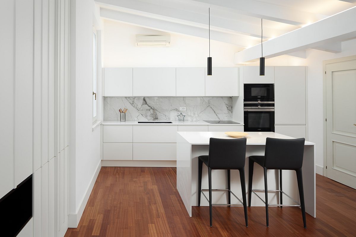 Sophisticated-minimal-kitchen-in-white-where-bar-chairs-and-appliances-usher-in-a-dash-of-black-39191