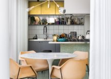 Stylish-Saarinen-Table-and-West-Elm-pendant-lighting-combined-to-create-a-glam-dining-area-28773-217x155