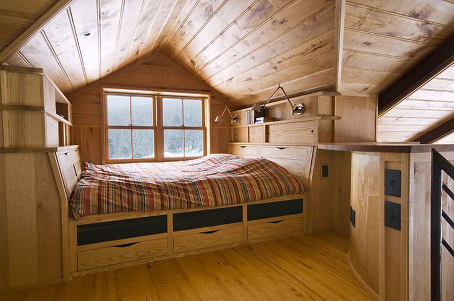 Tiny attic bedroom comes with ample storage space under the bed