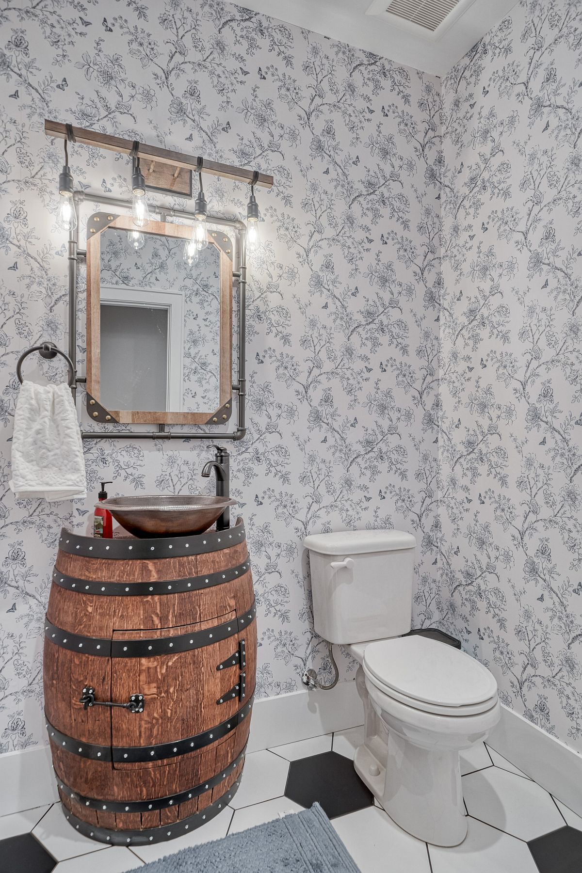 Touch of glam coupled with unique vanity for the powder room in gray