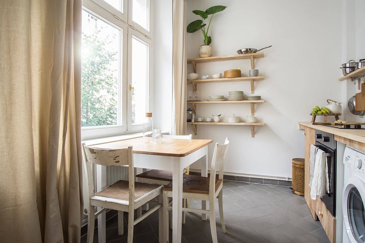 Wood and white kitchen and dining area with serene Scandinavian style