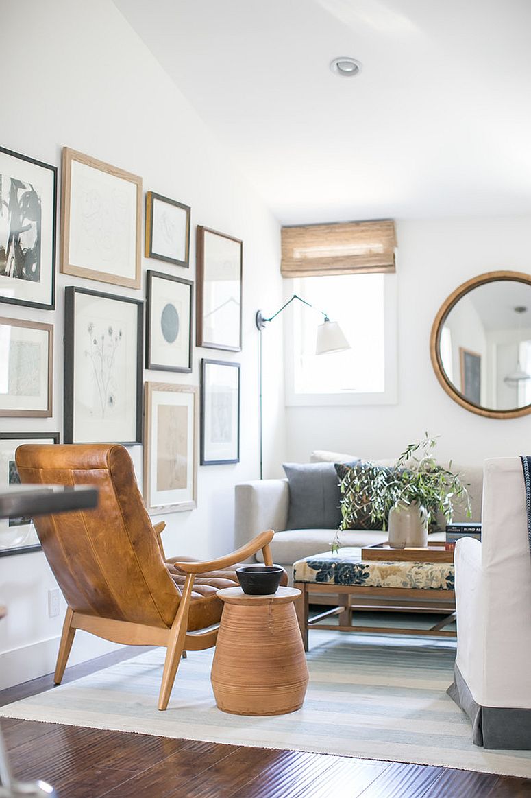 Wooden accents coupled with gallery wall in the tiny white living room