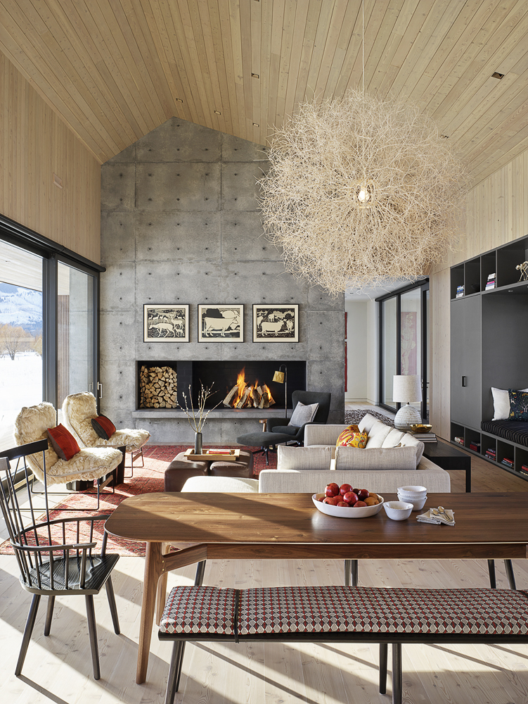 Wooden ceiling and concrete accent plan for the open plan living area of the gabled house in Jackson