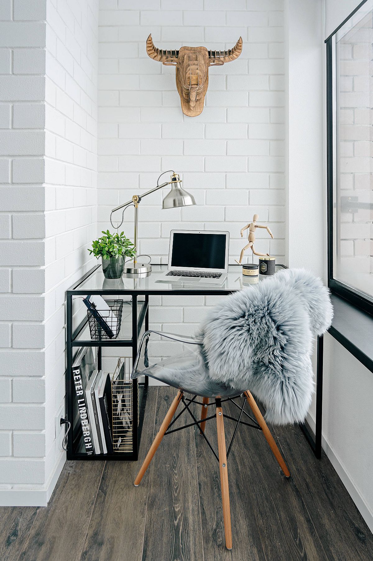 A sheltered balcony transformed into stylish home workspace