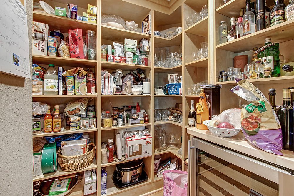 Ample storage units and shelves inside the industrial style pantry