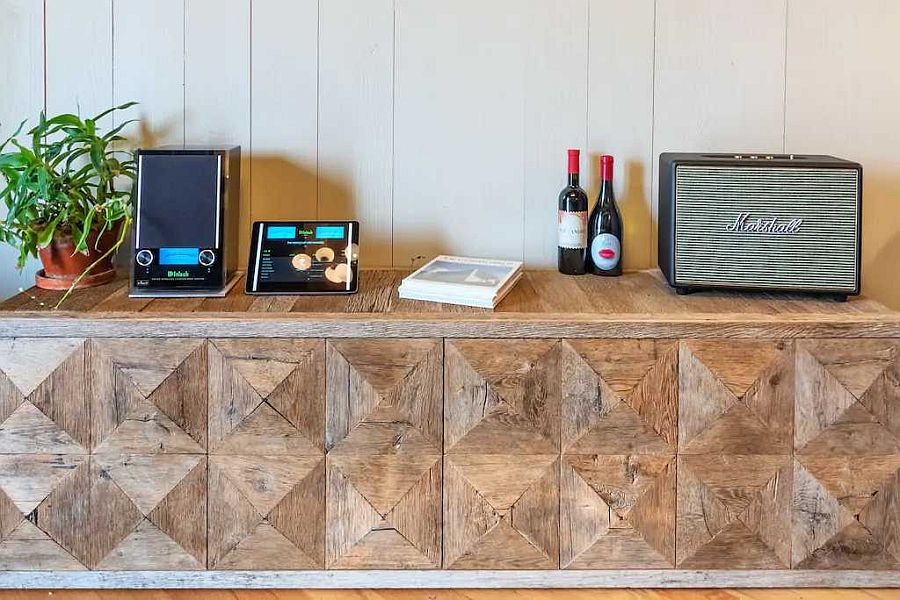 Bespoke credenza with a textured wooden finish brings pattern to the setting