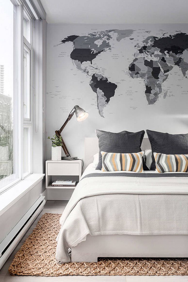 Black and white map on the walls blends in with the color scheme of the bedroom