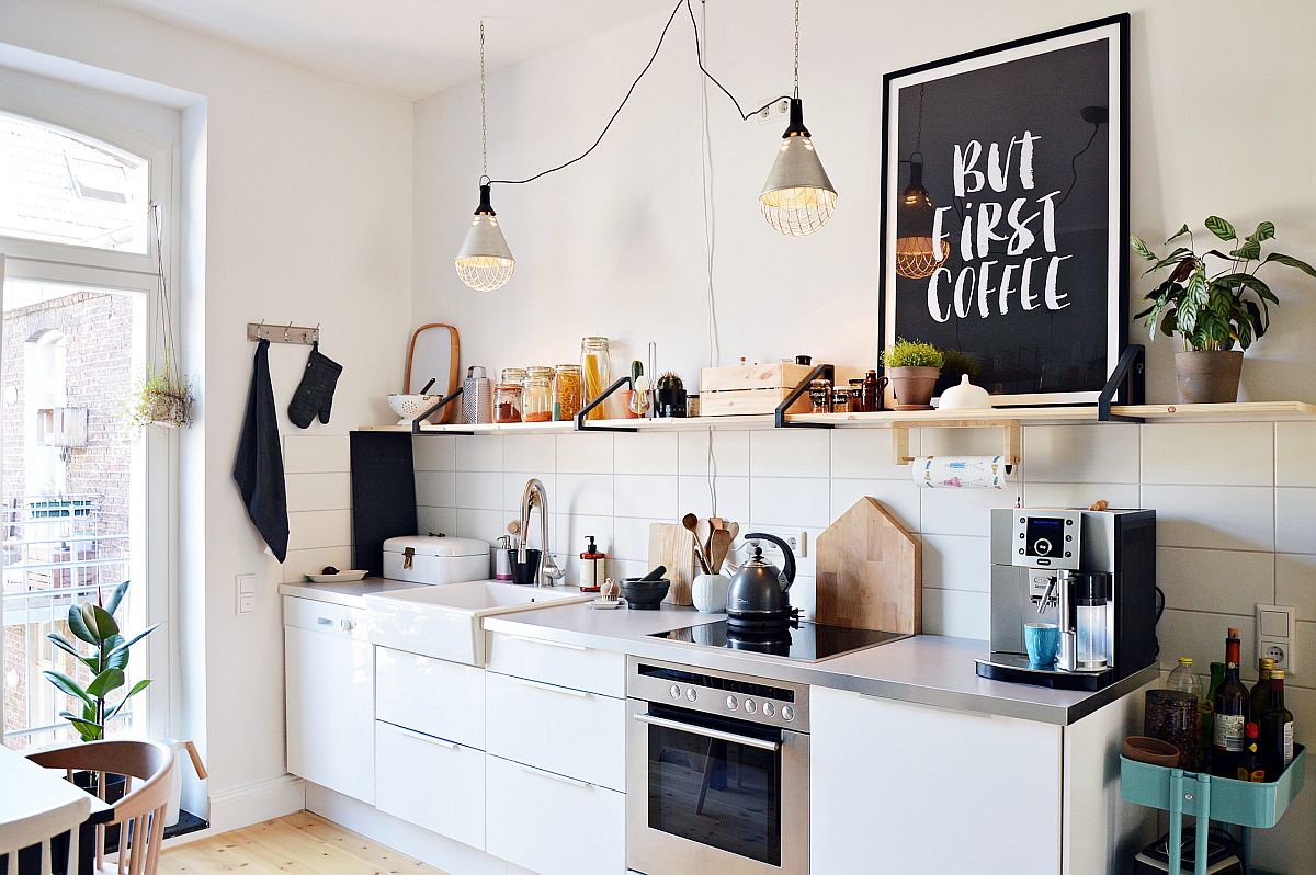 Coffee station sits at the end of the kitchen counter inside this small Scandinavian kitchen