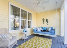 Combining-yellow-with-blue-in-the-spacious-porch-that-has-a-swing-86280-217x155