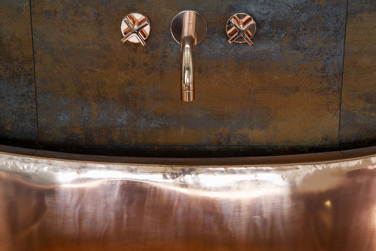 Copper adds sparkle to the bathroom along with vintage charm