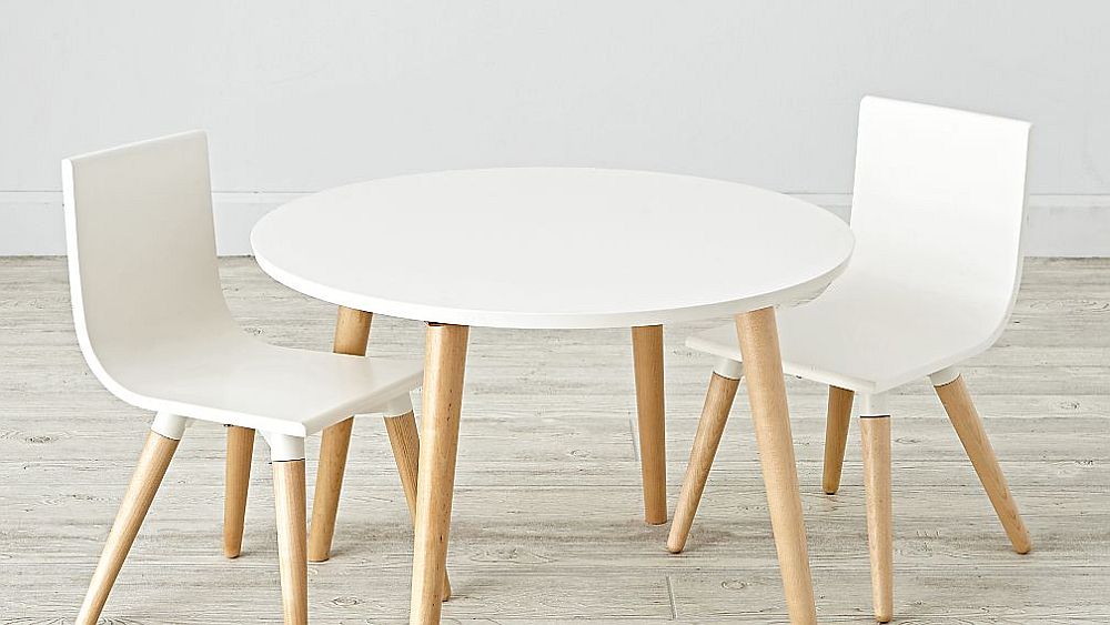 Crate & Barrel’s Pint Sized Toddler White Table and Chair Set, designed by Royce Nelson for the small playroom