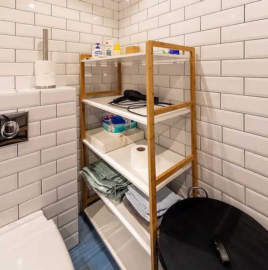 Custom standalone shelf in the bathroom to hold all your toliet supplies