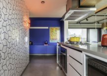 Custom-tiled-backdrop-for-the-small-kitchen-along-with-a-blue-home-bar-96312-217x155
