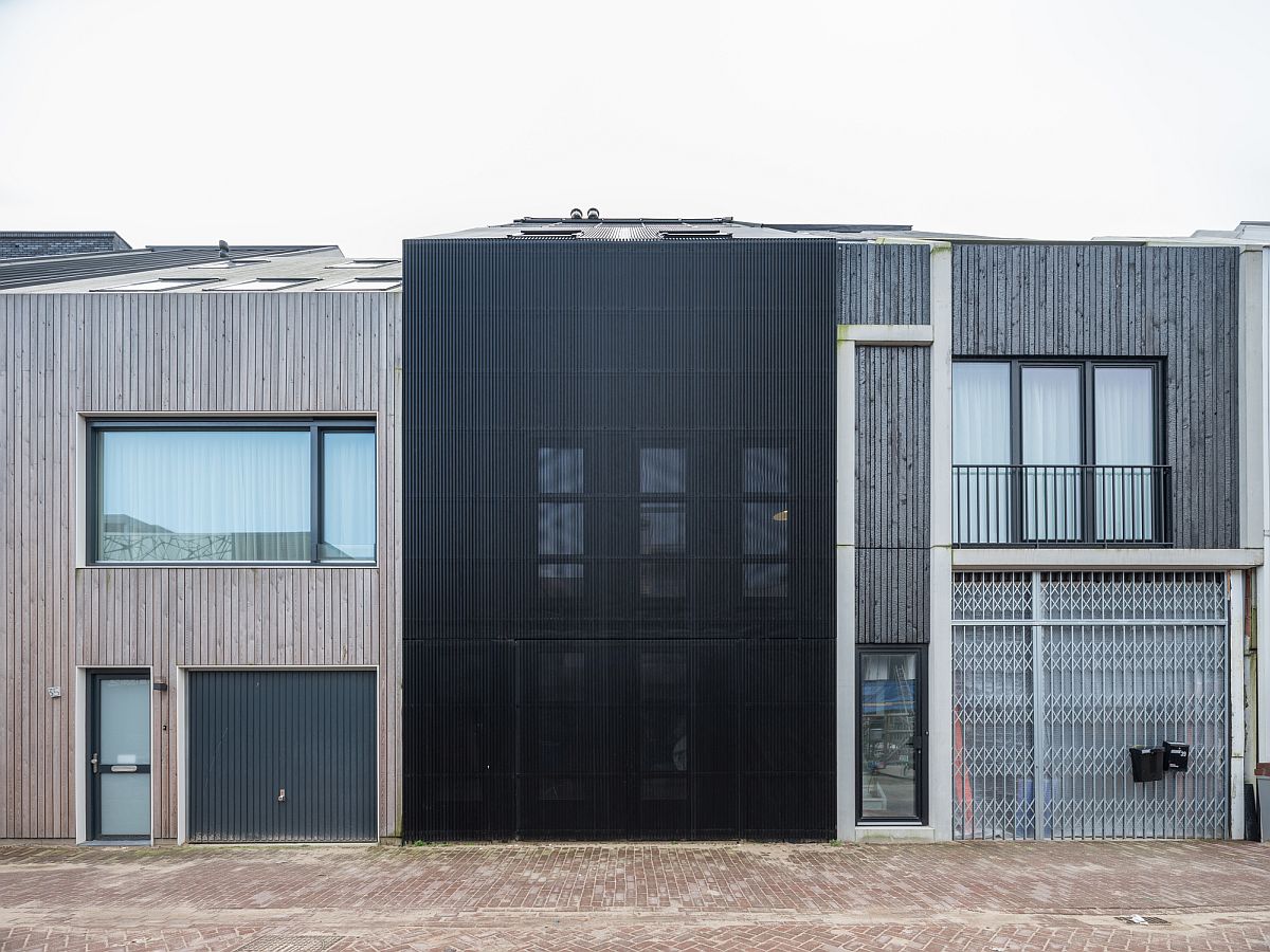 Dark exterior of the house gives it an exceptional facade that makes visual impact