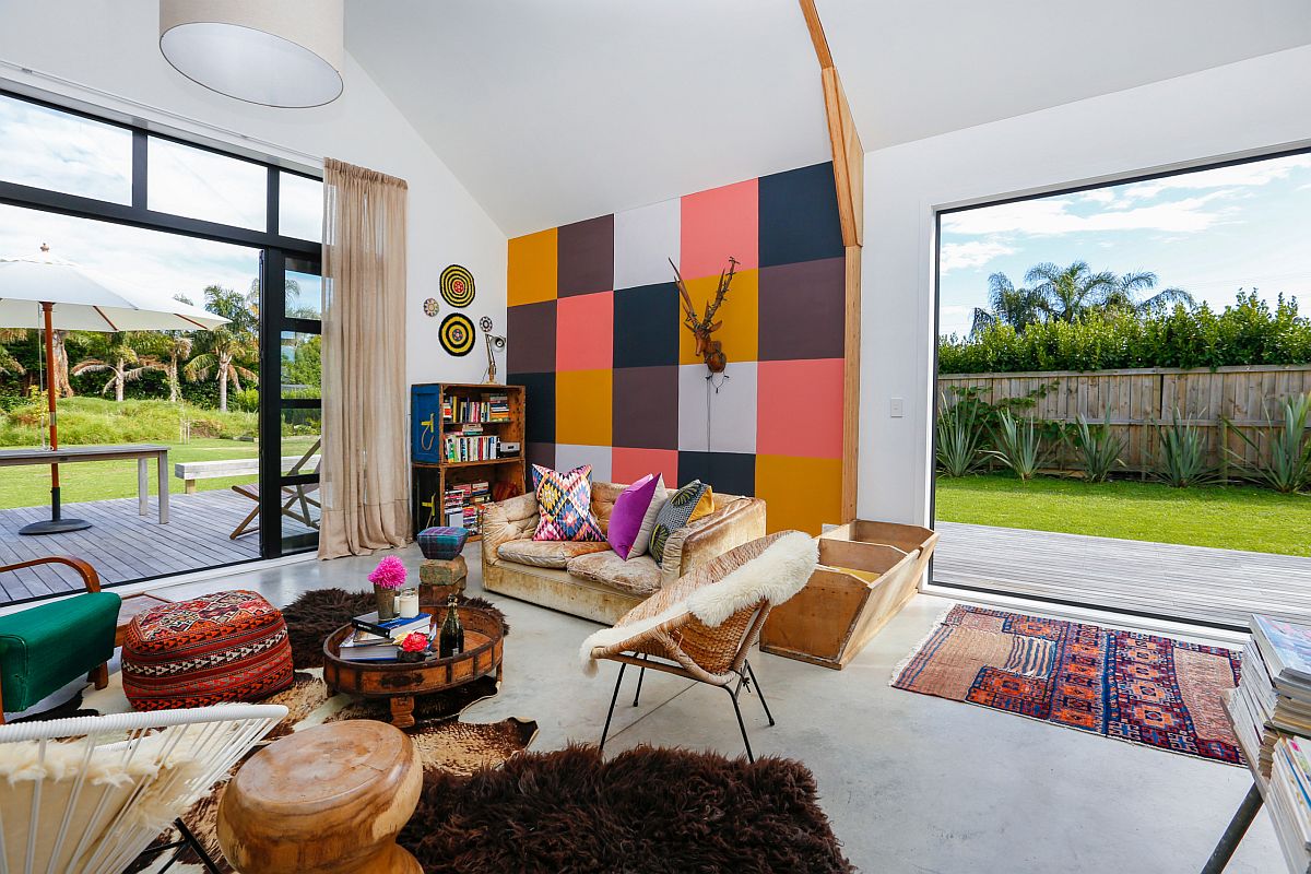 Eclectic blend of colors in the living room with modern backdrop