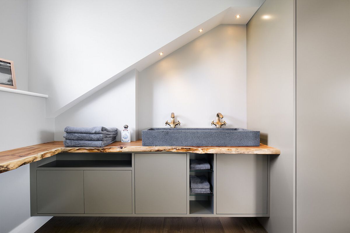 Ewe wood worktops combined with granite washbasins inside the opulent bathroom