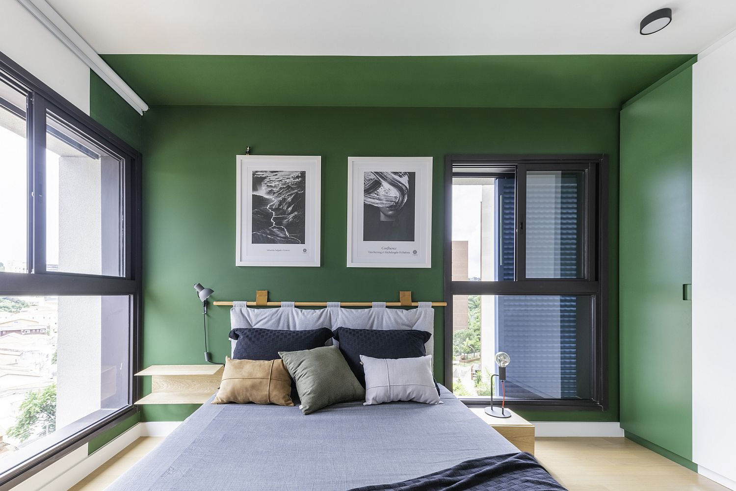 Exquisite modern bedroom with green accent wall and comfy decor